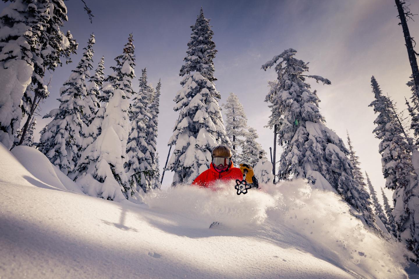 A person skiing through powder