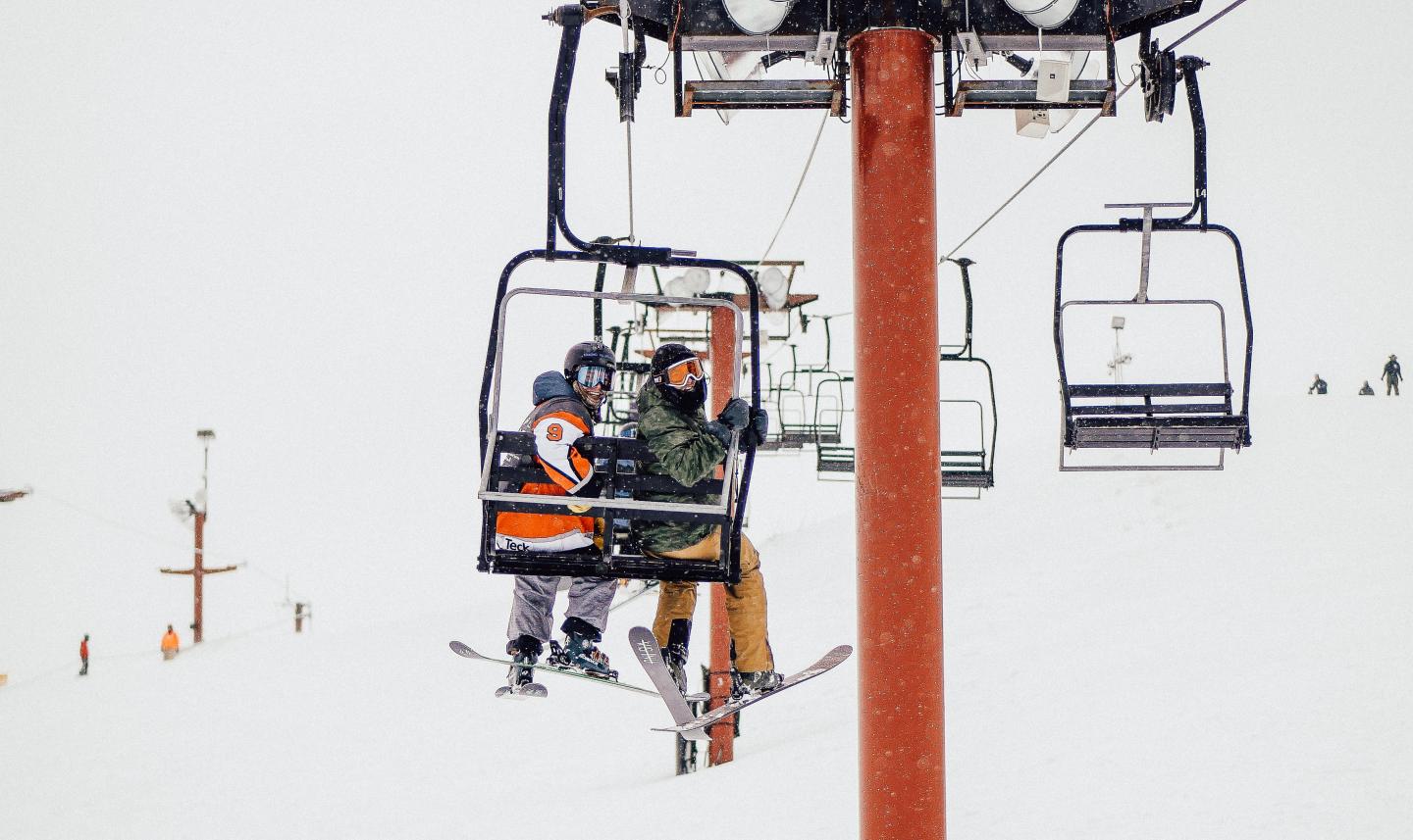 Two people on a chairlift