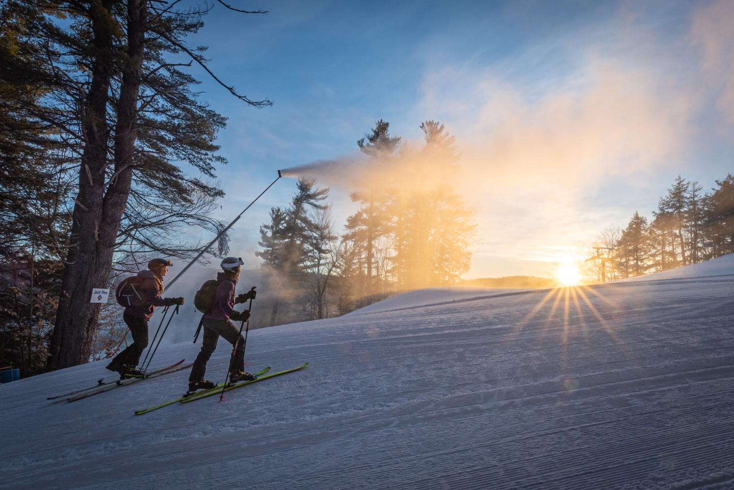 skiers skinning up hill