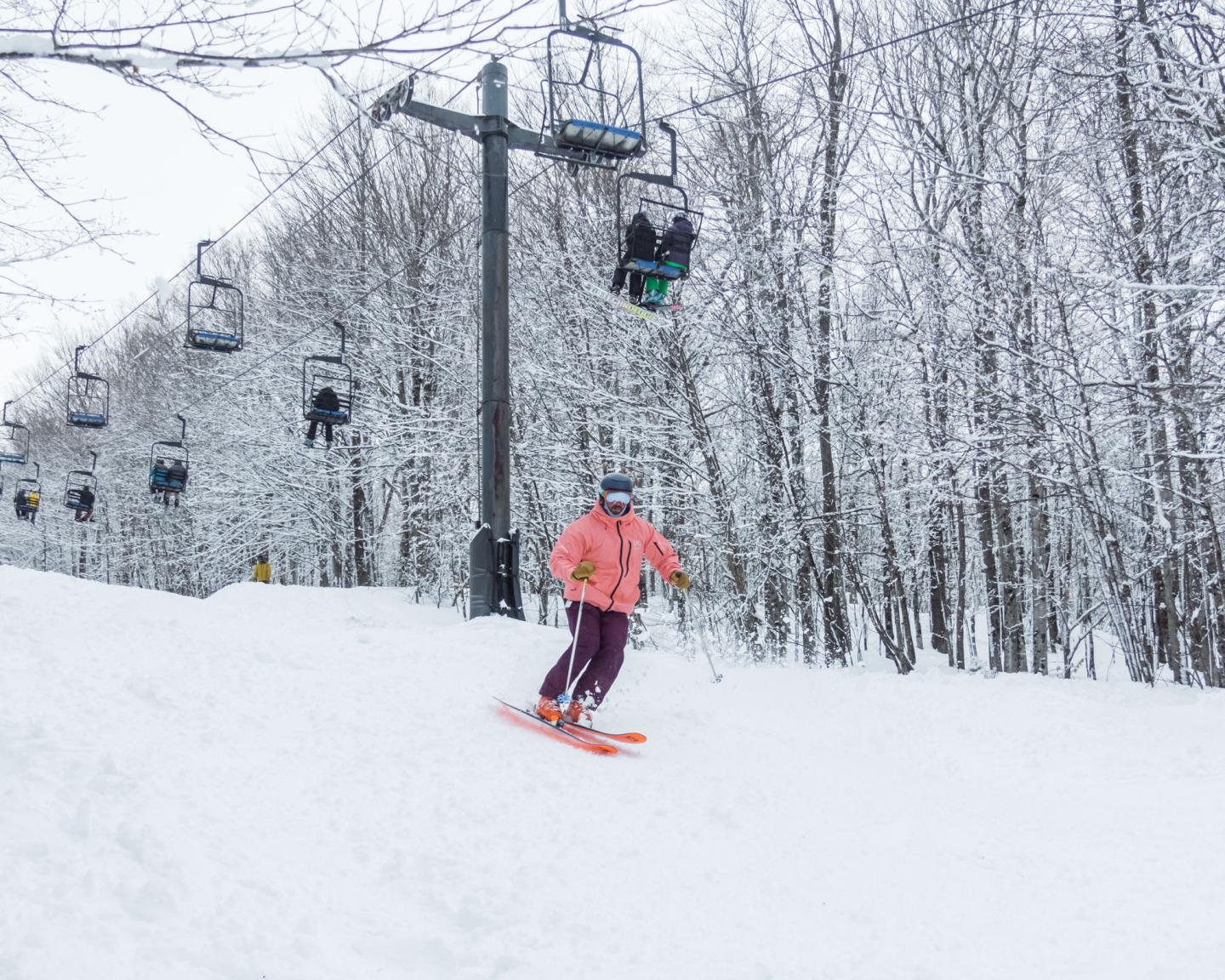skiing under chairlift