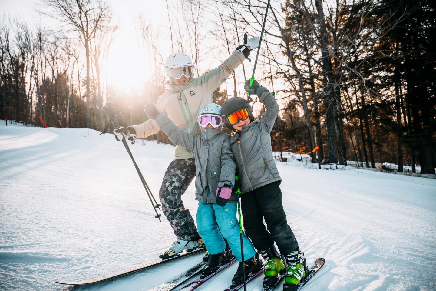 family of skiers posing