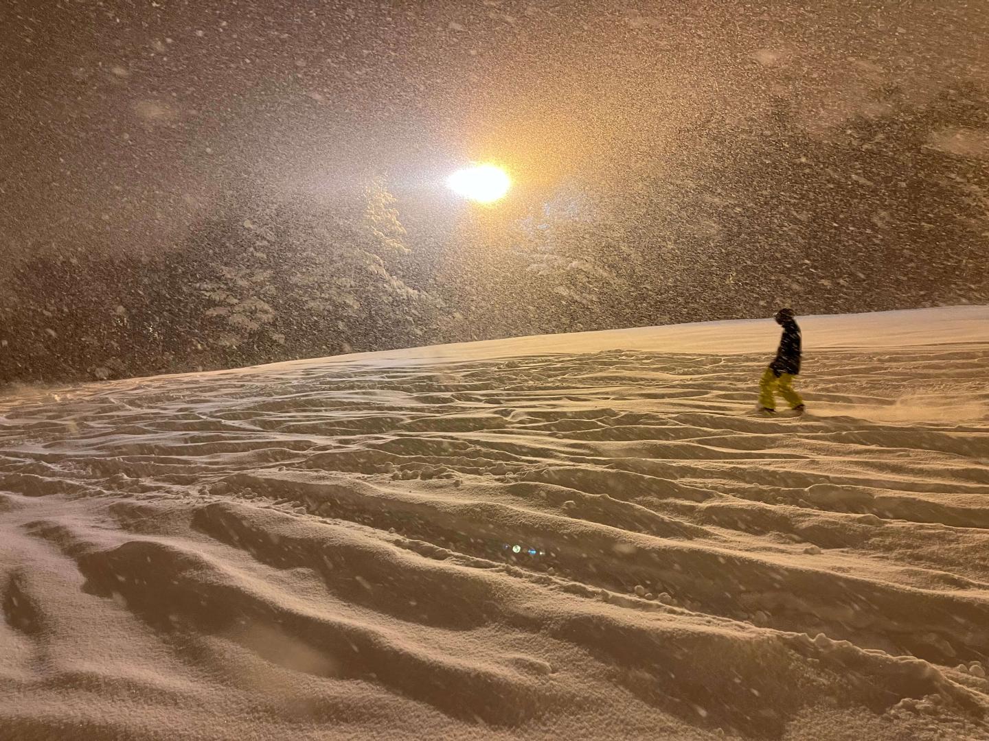 Snowboarder at sunset at Washigatake Ski Resort
