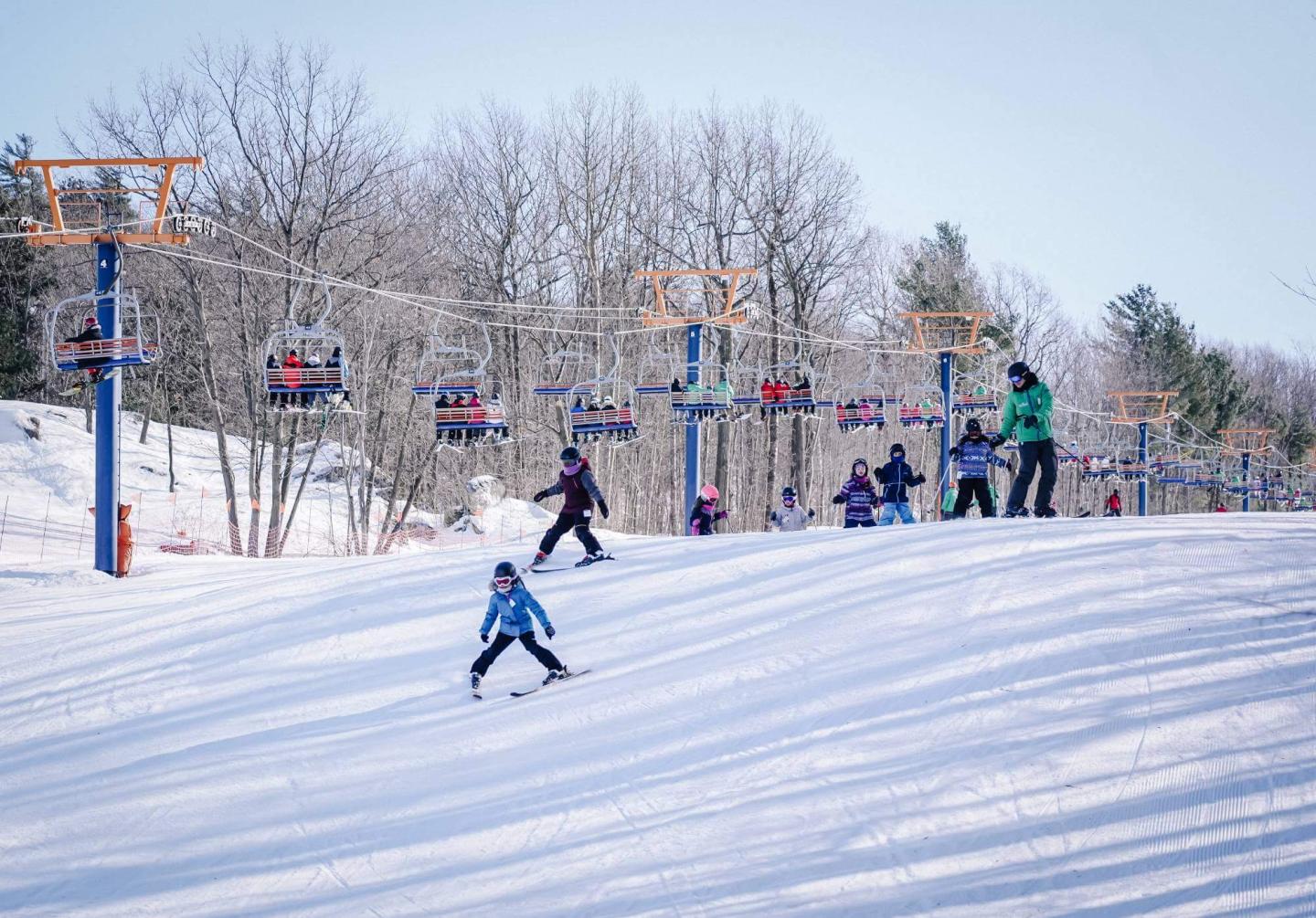 Mont Rigaud skiers by lift