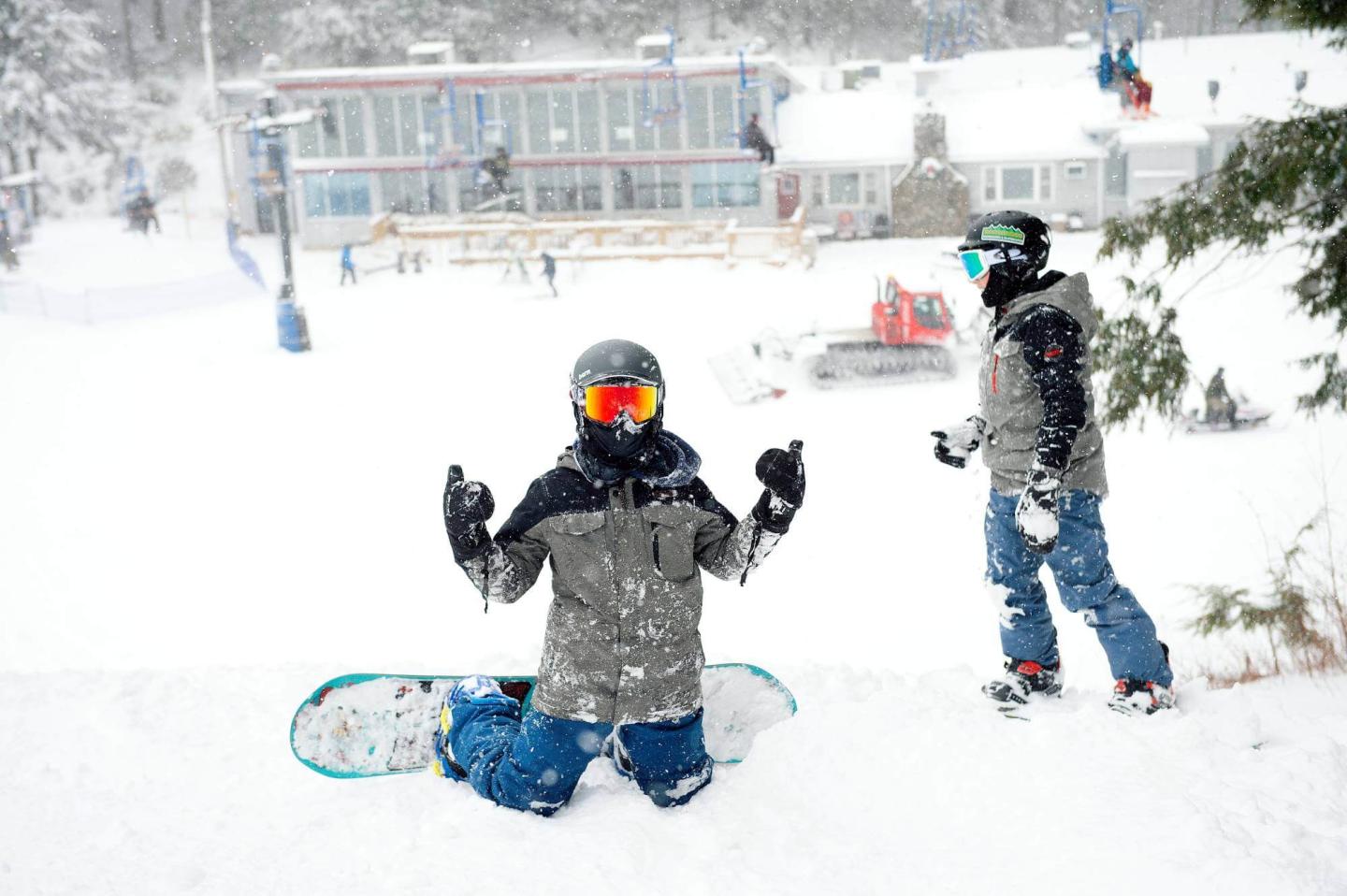 Lost Valley snowboarders thumbs up