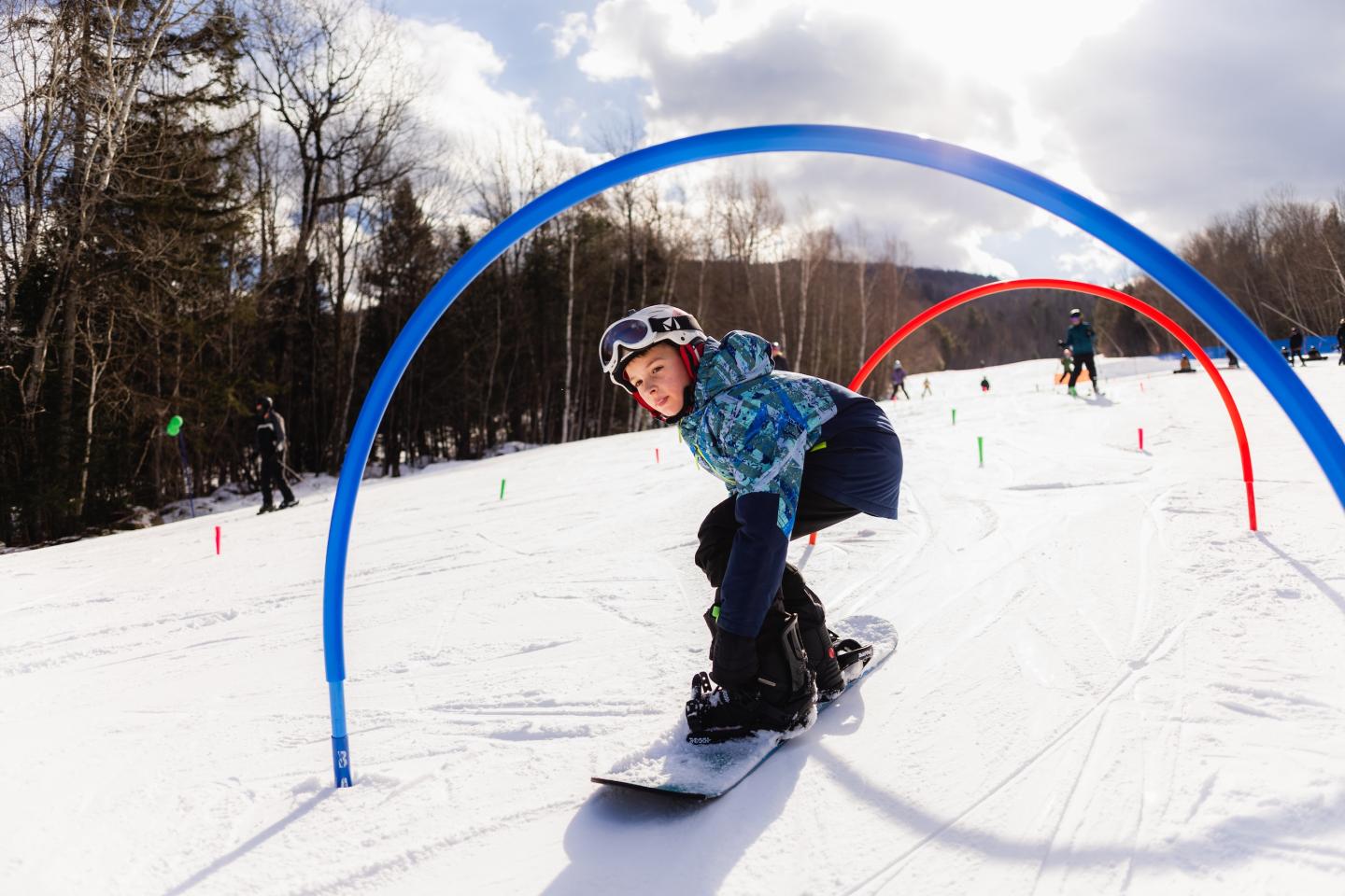 snowboarder going through hoop