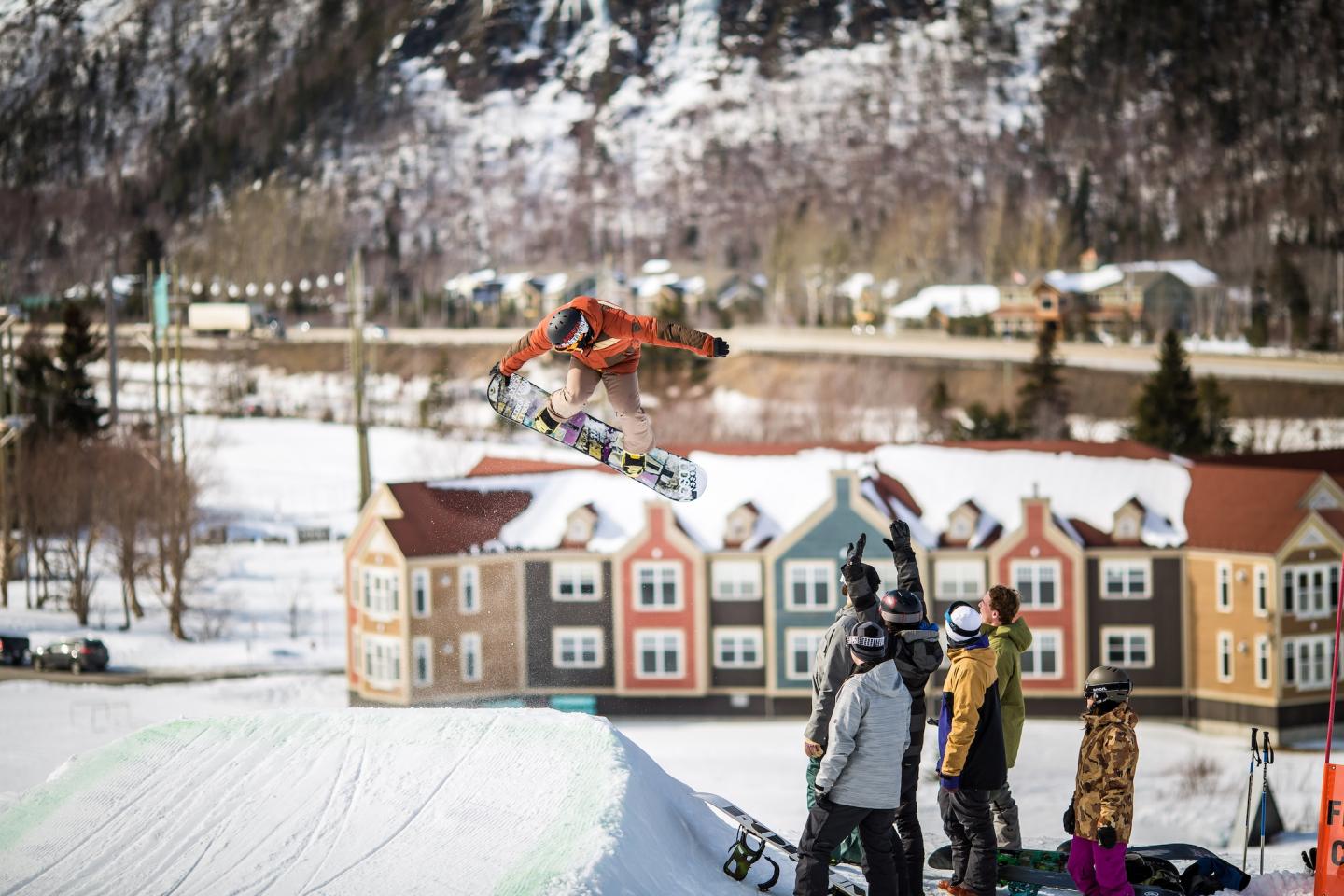 snowboarder in the air as people cheer