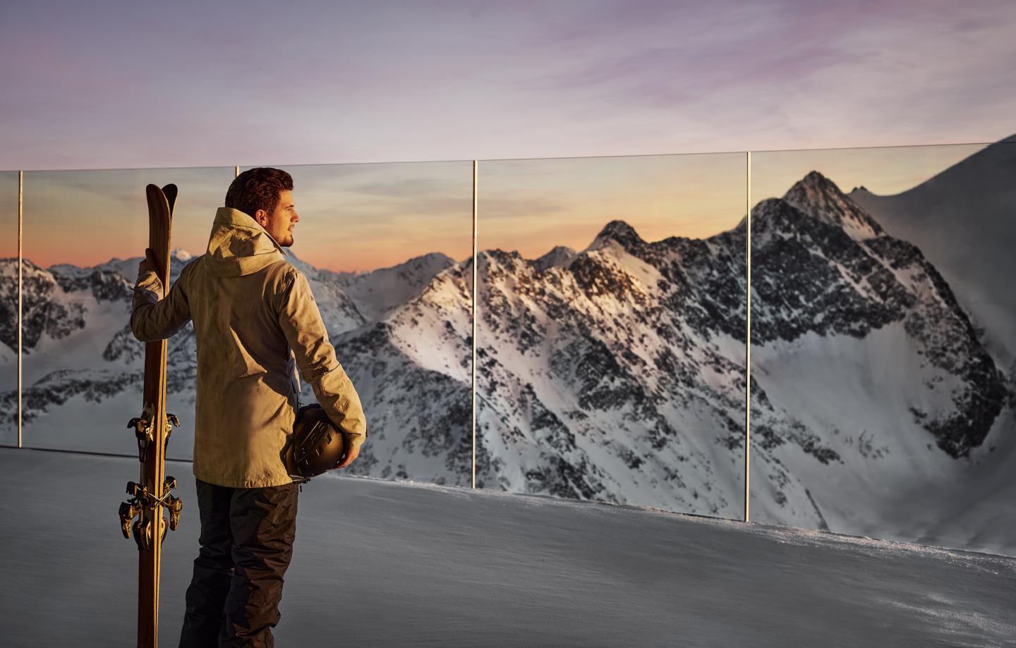 person overlooking mountain top lookout