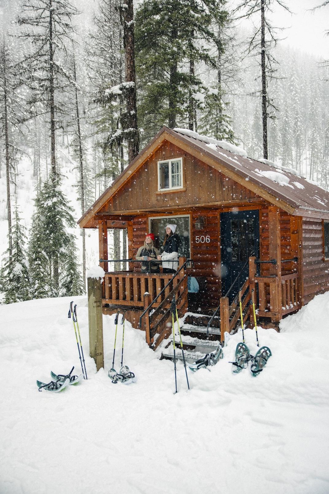 skiers on a cabin porch