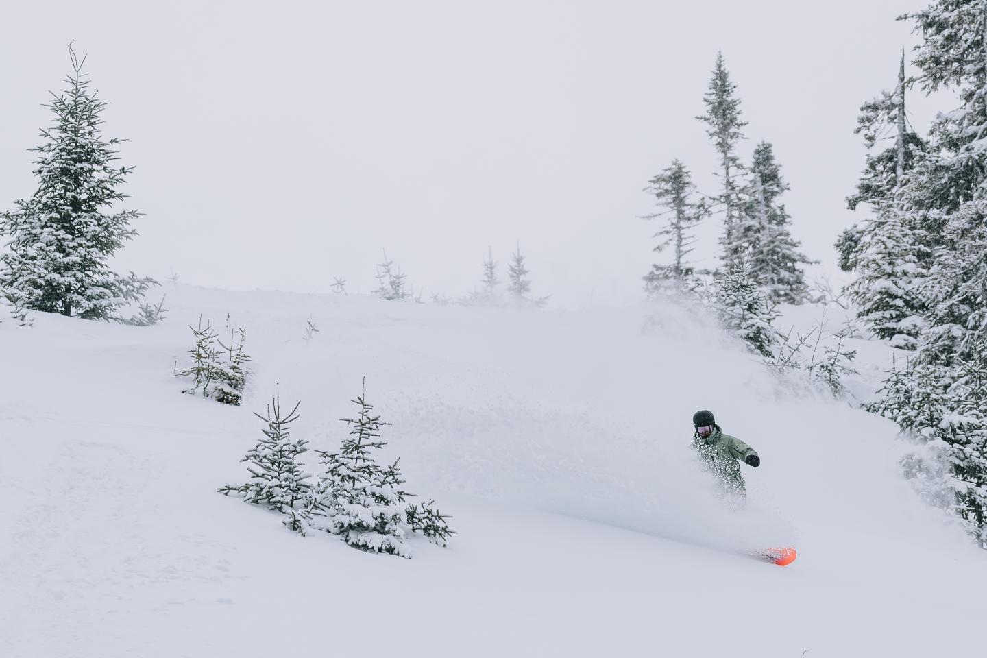 snowboarder going down mounatin