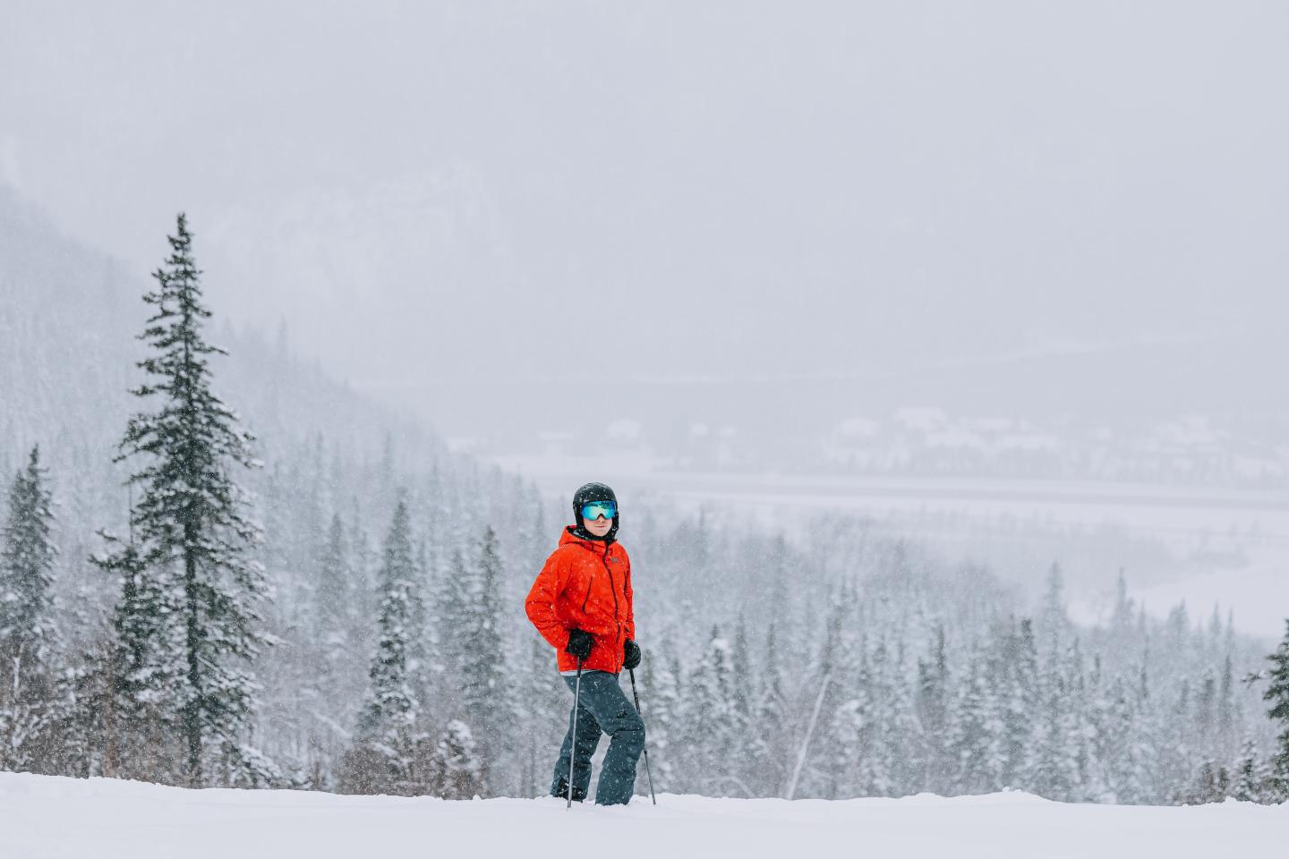 skier walking across frame