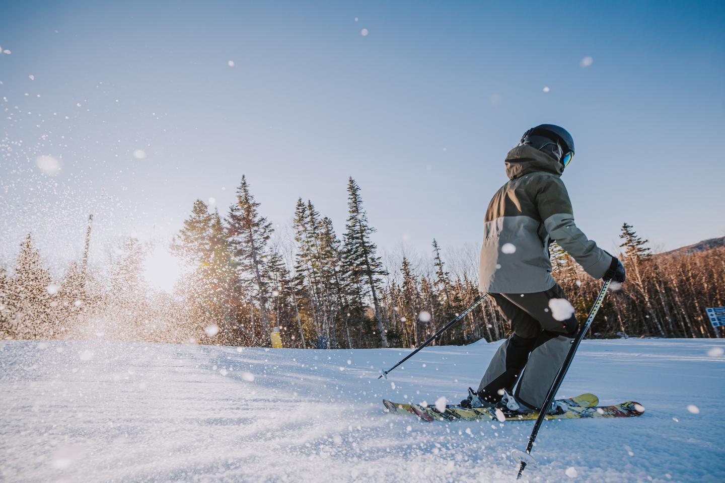 close up of skier going down mountain
