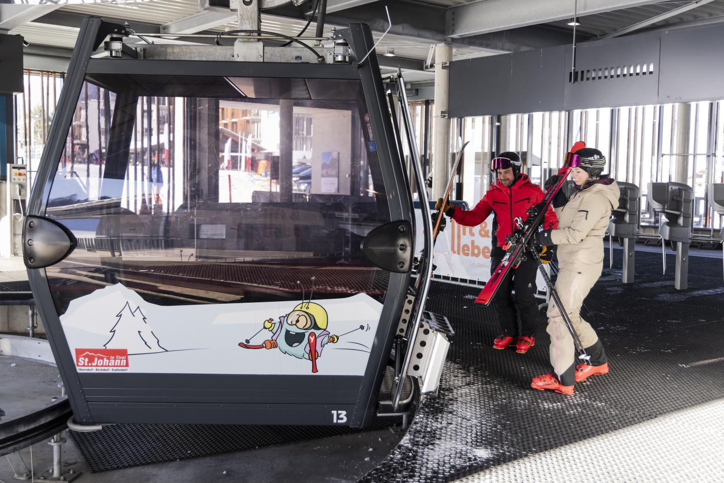 people getting on the gondola at St. Johanner Bergbahnen 