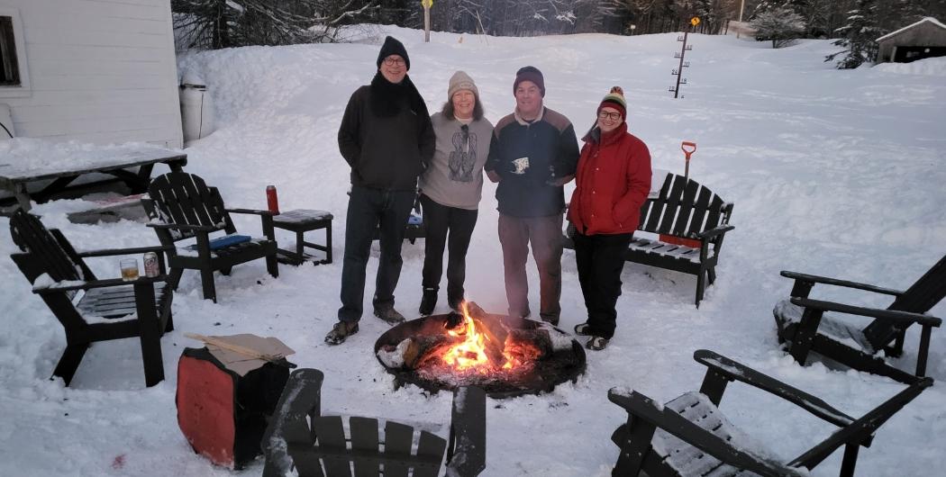 group of friends enjoying the fire pits at Osceola Tug Hill 2