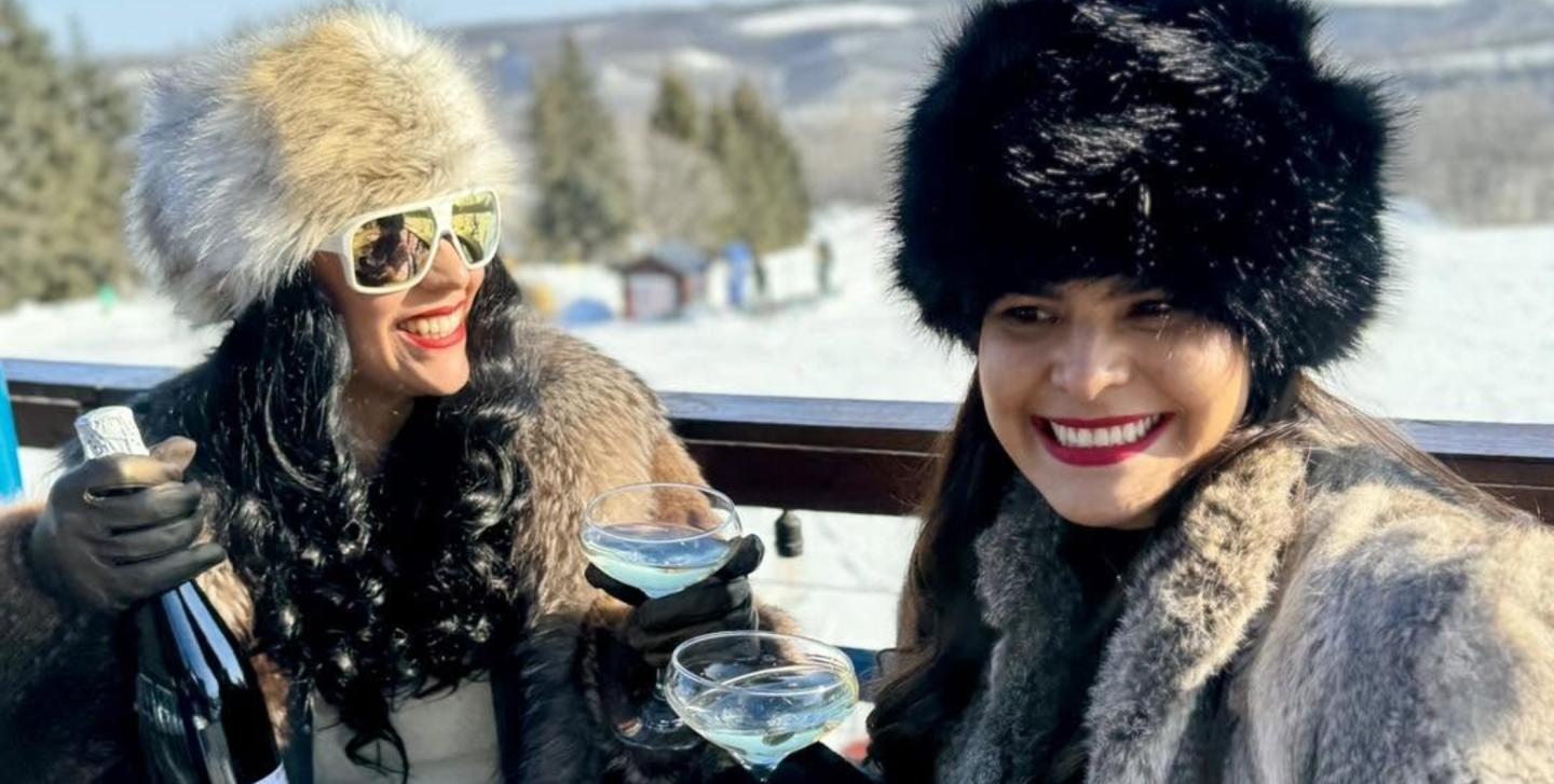 two women enjoying some champagne at frost fire park