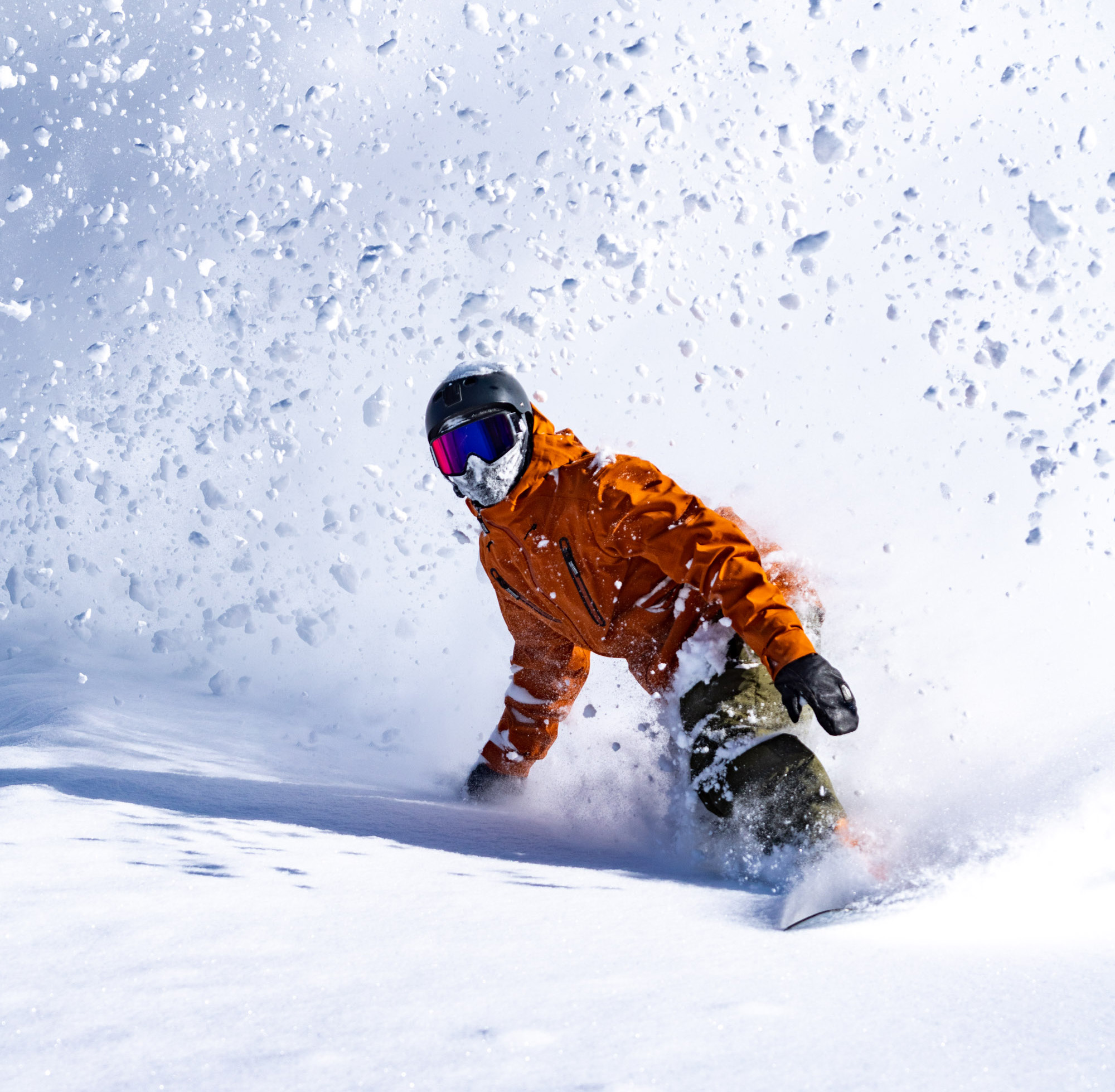 Snowboarder rides powder at Powder Mountain