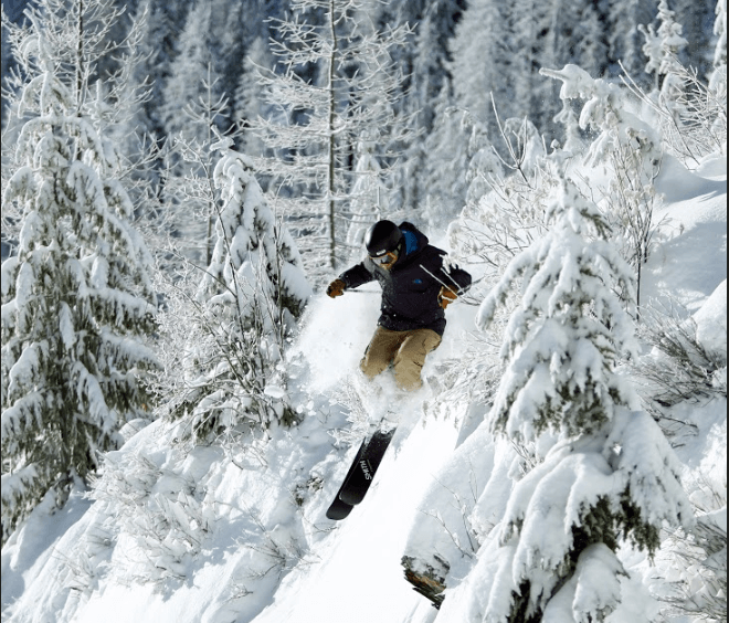 skier at Silver Mountain Idaho skiing down hill