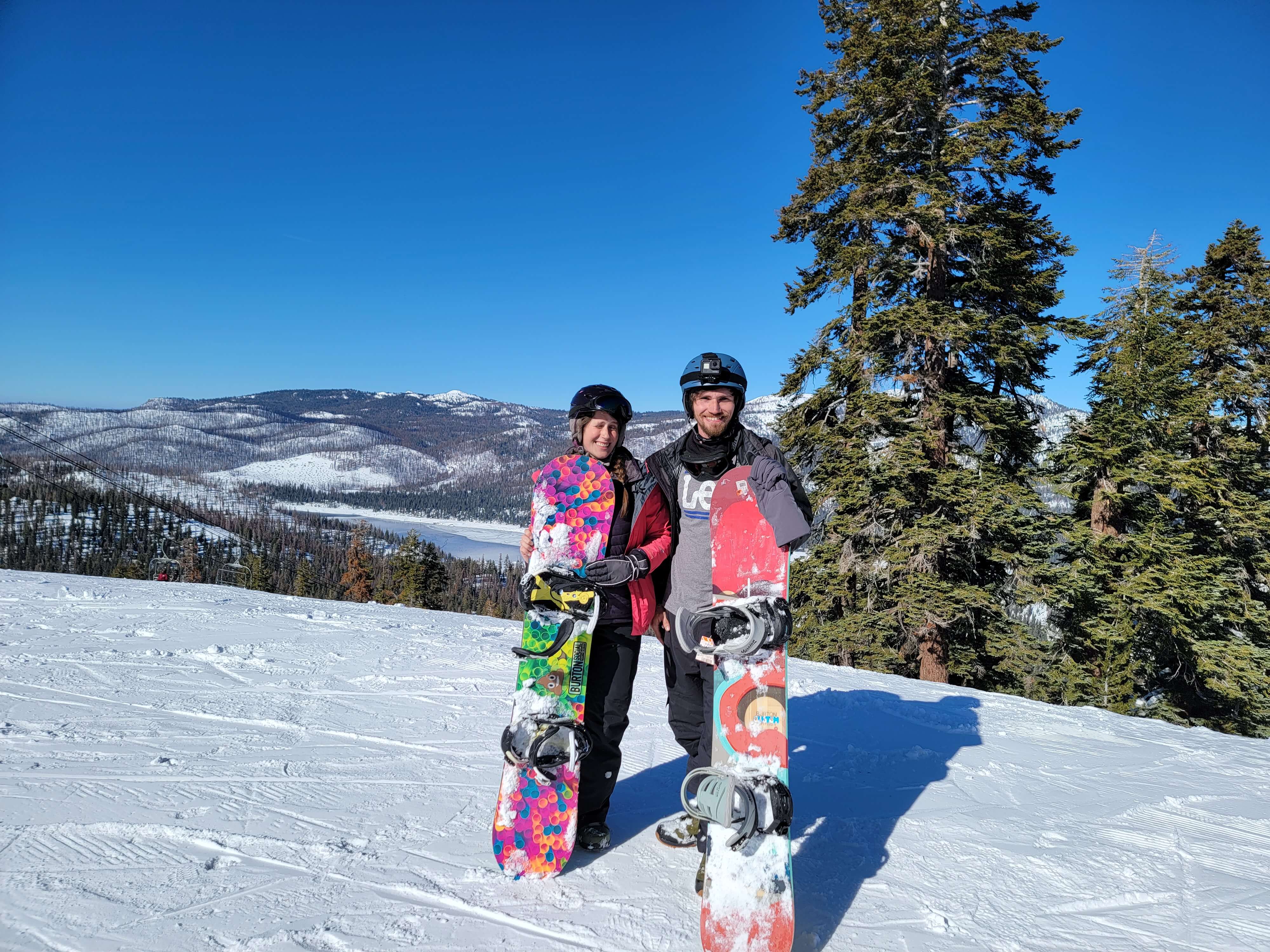 Andrea and Brian holding snowboards China Peak, CA