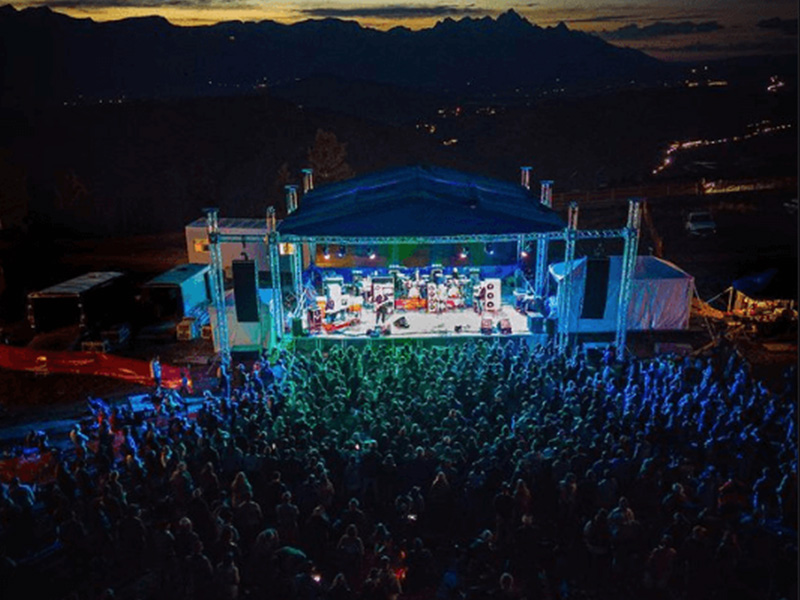A concert in the slope side with a large audience and lights at SnowKing, WY