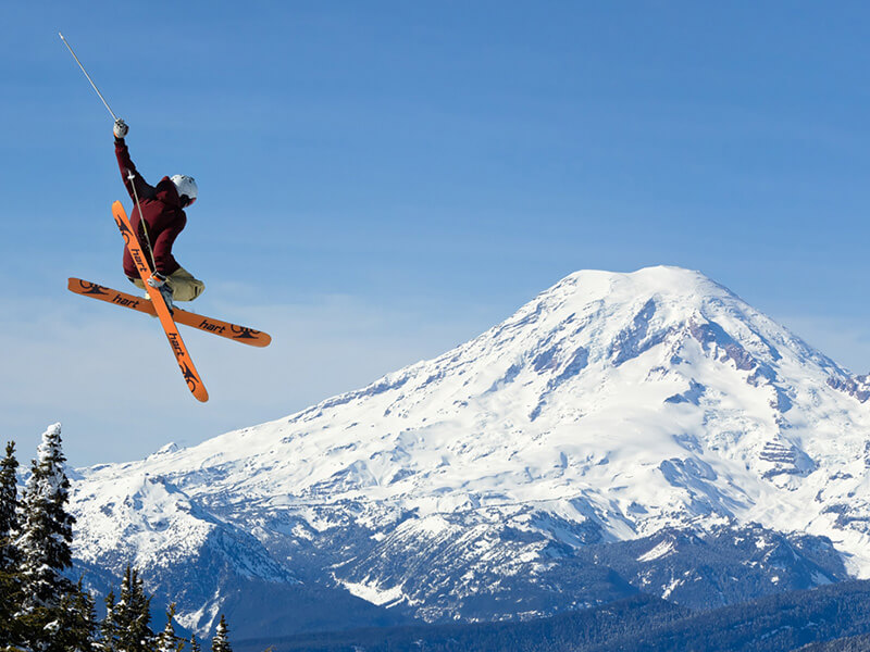 Skier at White Pass, WA with view of Mt. Rainer